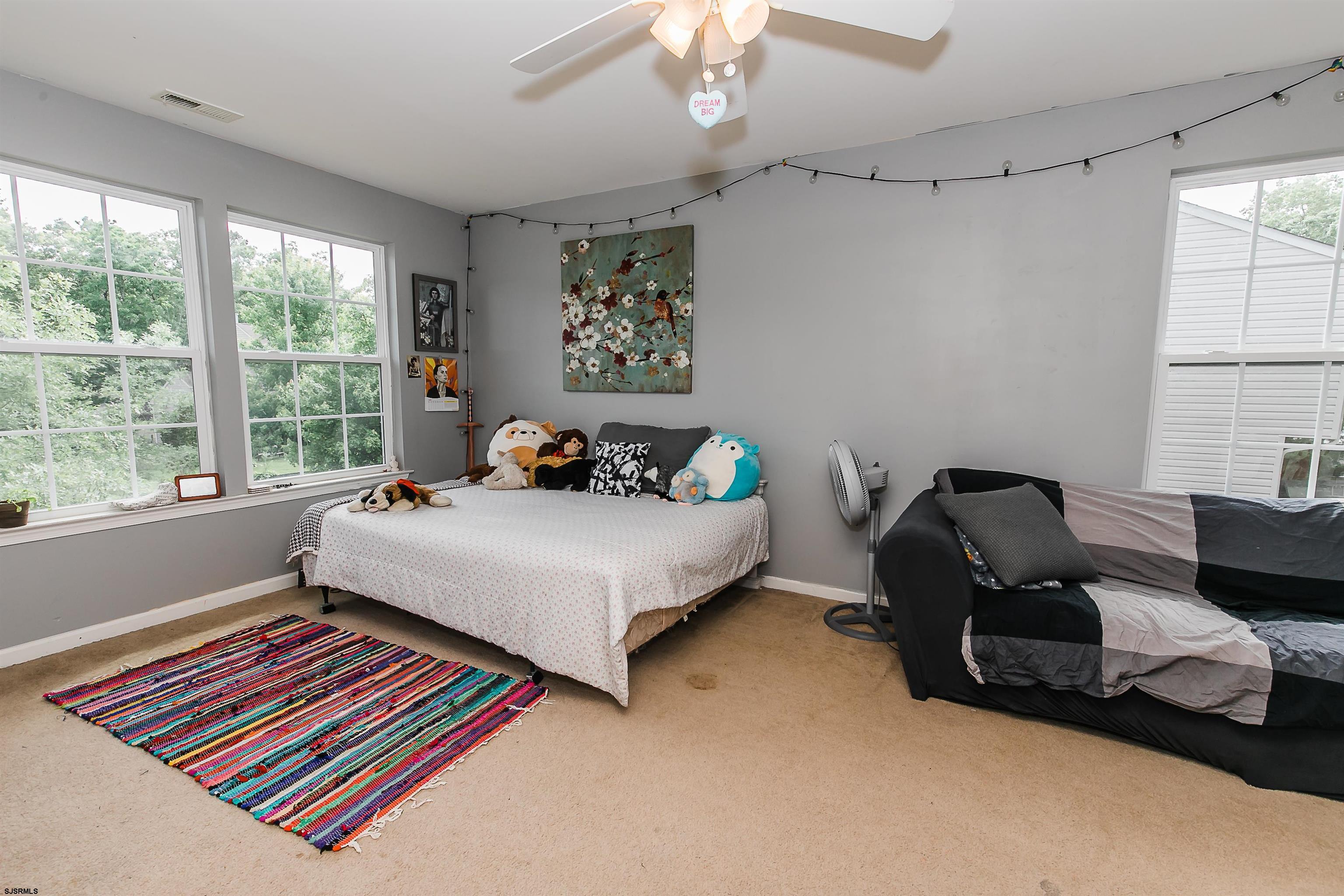 16 Cottage Road Egg Harbor Township, NJ 08234 - Photo 21 of 24 a bedroom with a bed and window