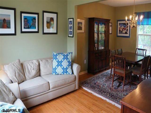 16 Cottage Road Egg Harbor Township, NJ 08234 - Photo 3 of 24 a living room with furniture and a dining table