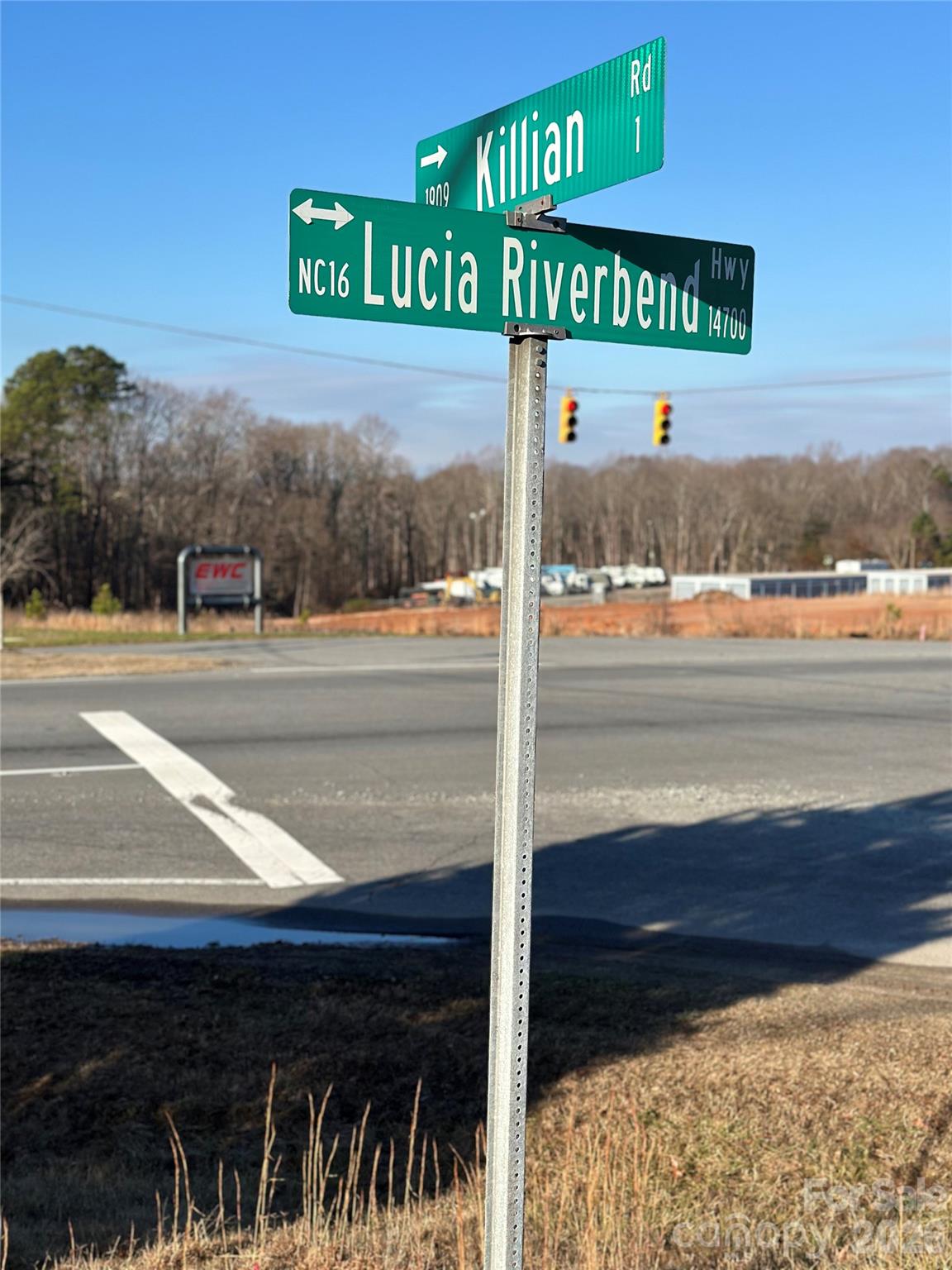 122 Julius Mac Road Stanley, NC 28164 - Photo 13 of 17 a street sign on a street next to a road