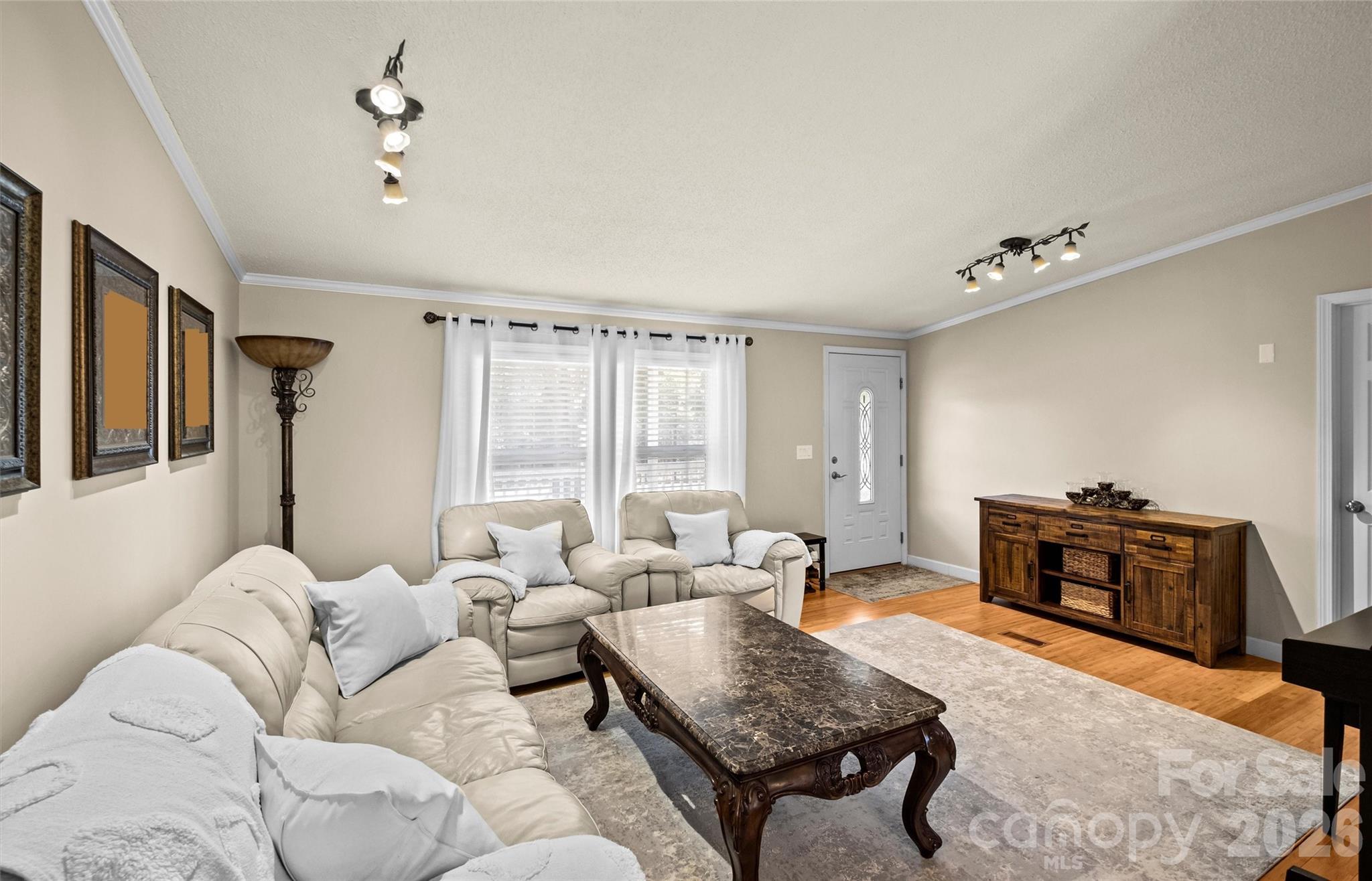 122 Julius Mac Road Stanley, NC 28164 - Photo 8 of 17 a living room with furniture and wooden floor