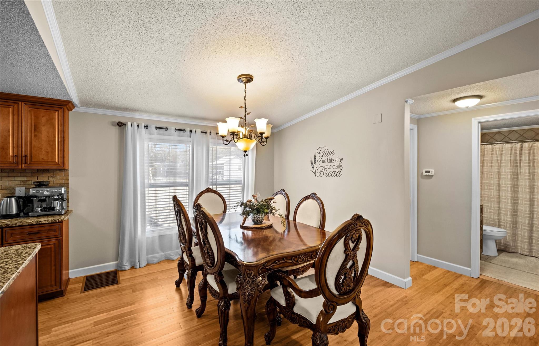122 Julius Mac Road Stanley, NC 28164 - Photo 9 of 17 a view of a dining room with furniture and chandelier