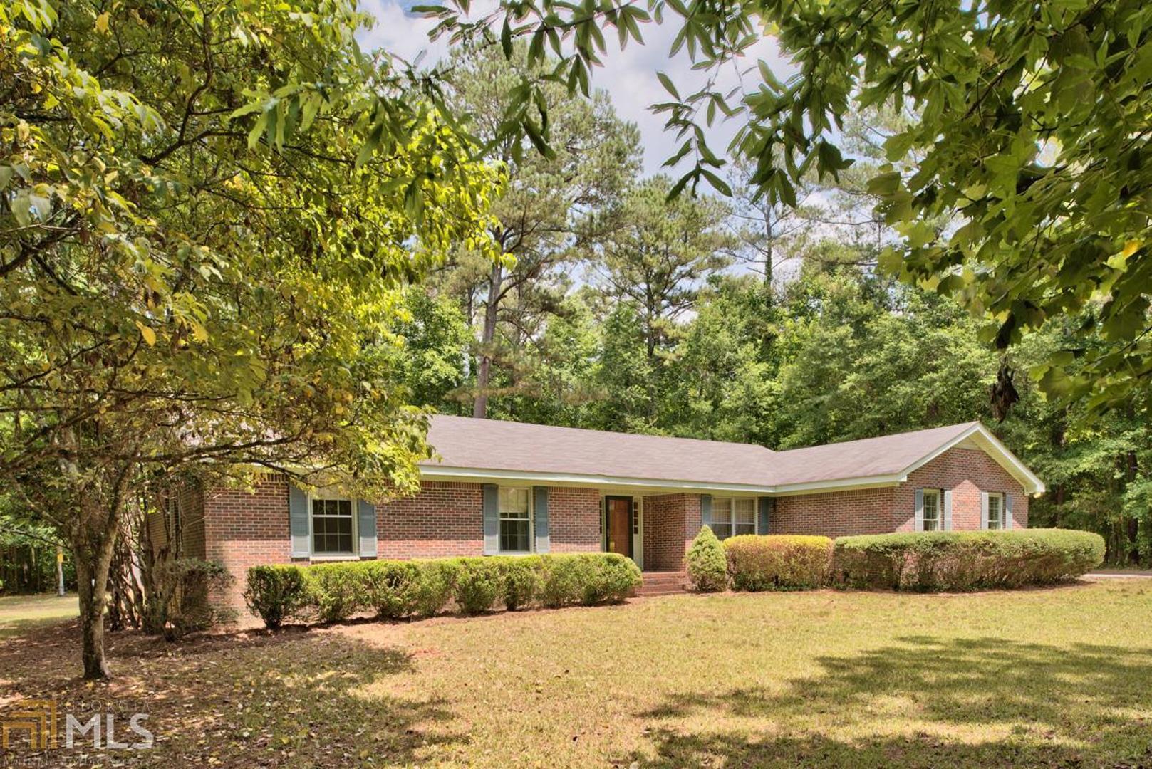 4390 Atlanta Highway Rutledge, GA 30663 - Photo 1 of 1 a front view of a house with a yard covered in snow