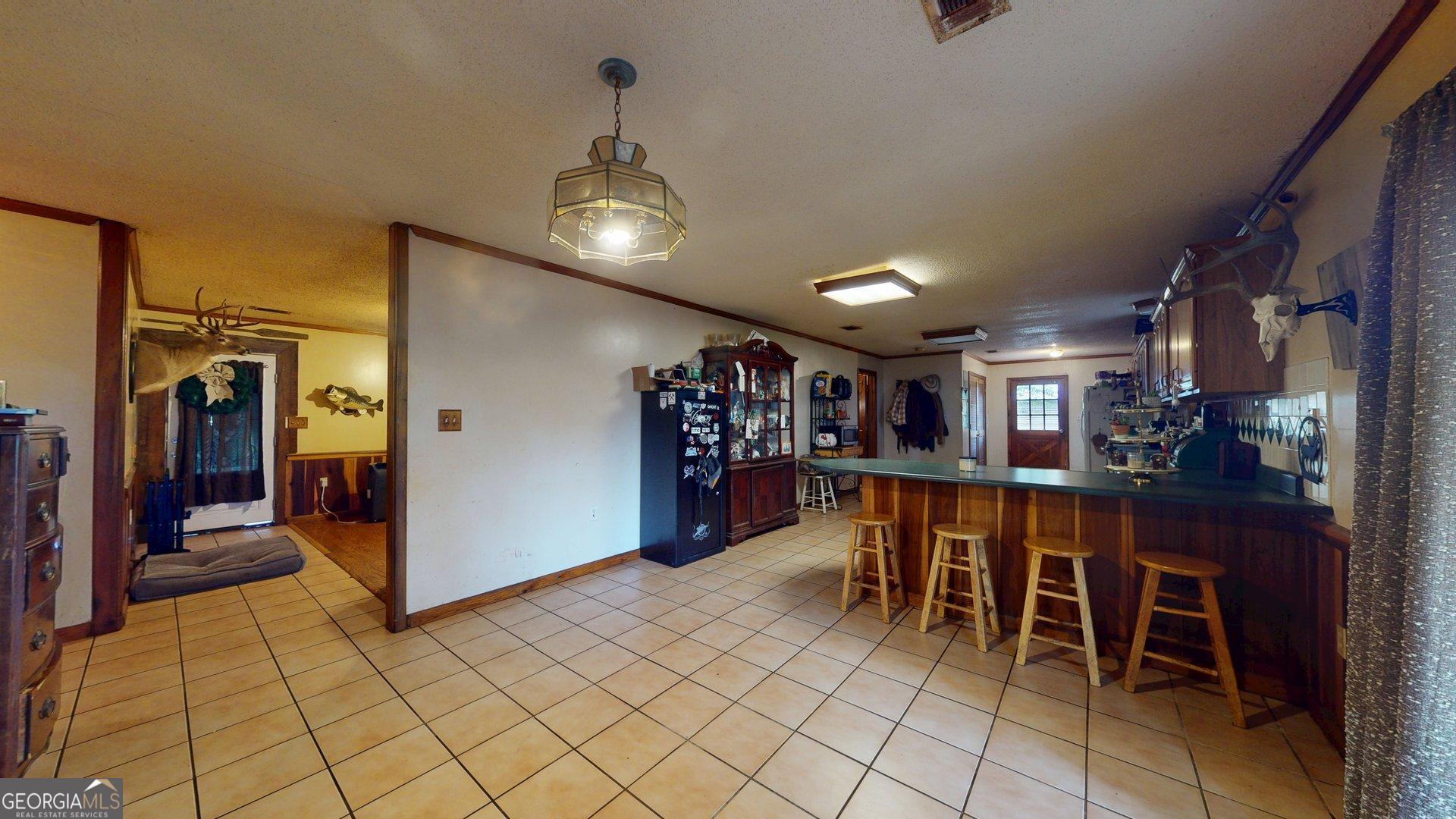 450 Bellevue Plantation Road Millen, GA 30442 - Photo 14 of 25 a view of a dining room with furniture