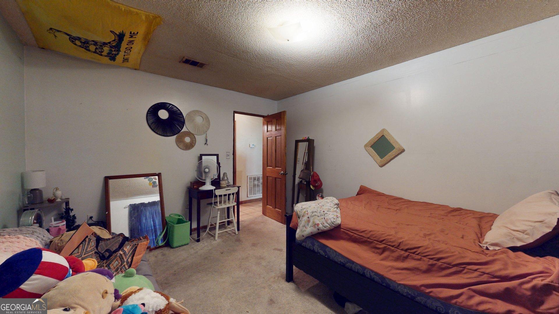 450 Bellevue Plantation Road Millen, GA 30442 - Photo 17 of 25 a living room with furniture