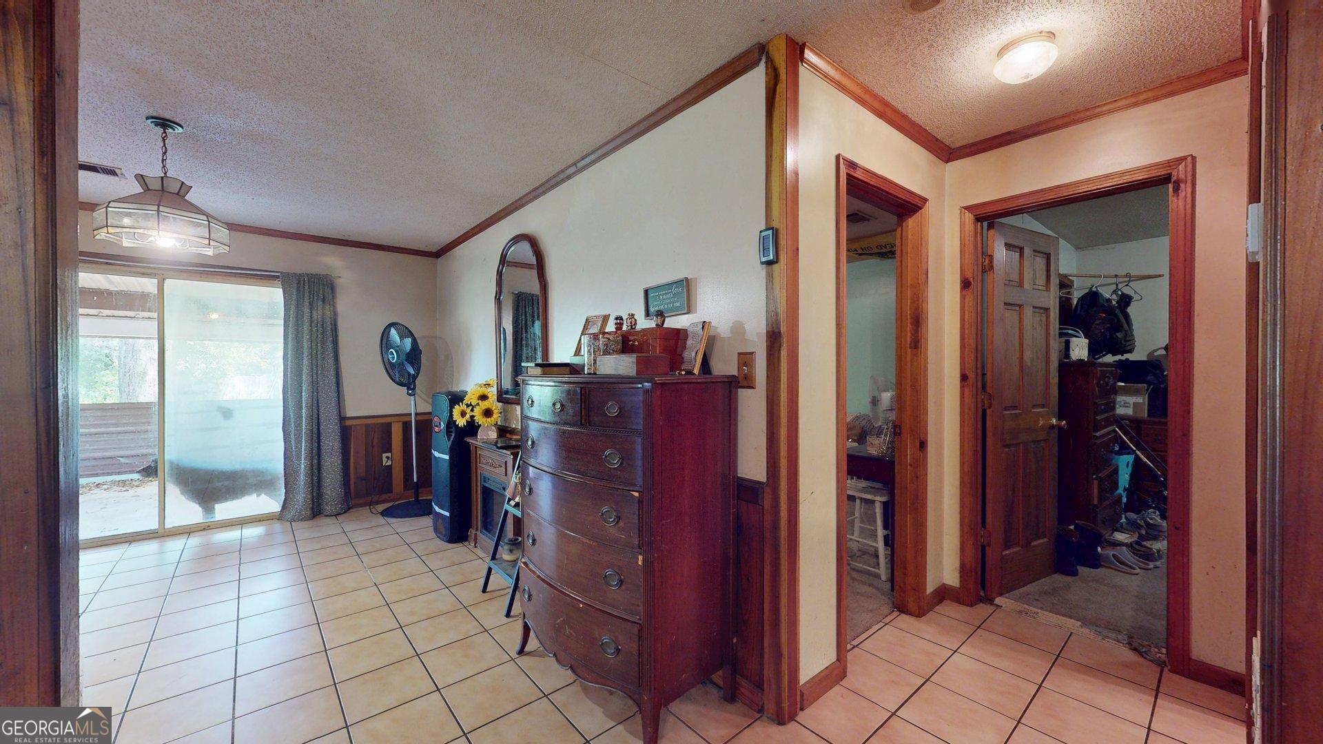 450 Bellevue Plantation Road Millen, GA 30442 - Photo 20 of 25 a view of a hallway with closet and furniture