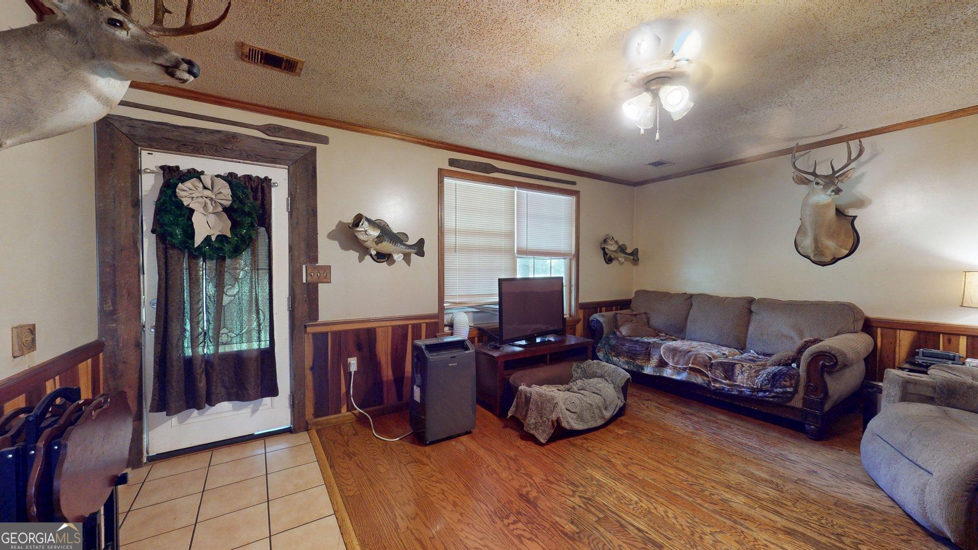 450 Bellevue Plantation Road Millen, GA 30442 - Photo 21 of 25 a living room with furniture and a window