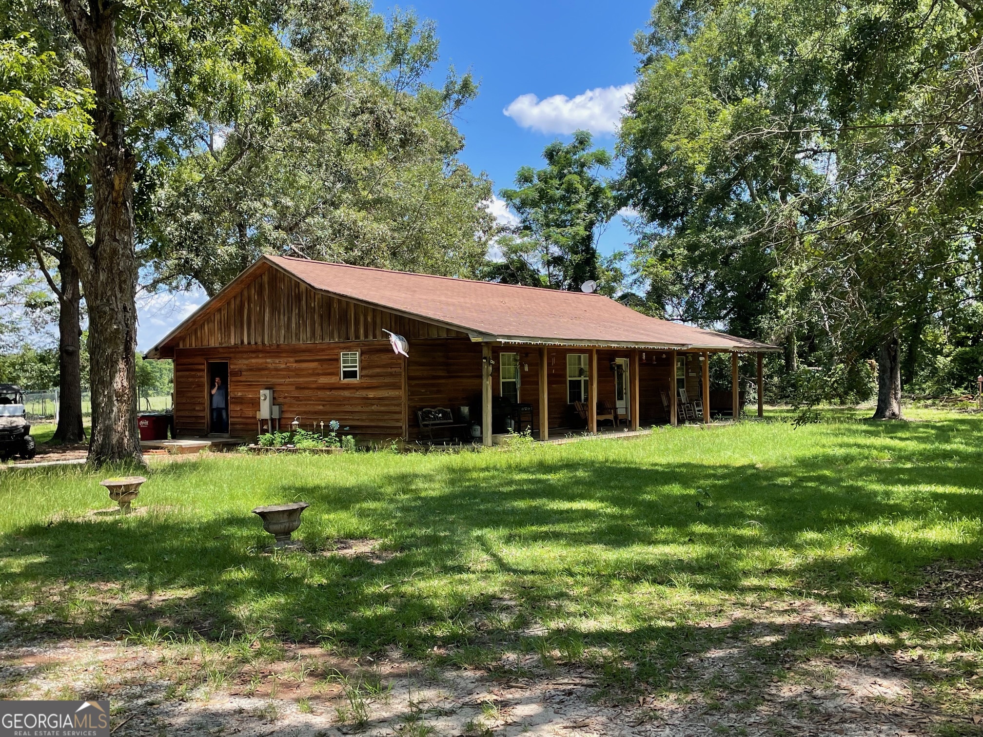 450 Bellevue Plantation Road Millen, GA 30442 - Photo 3 of 25 a front view of a house with a garden