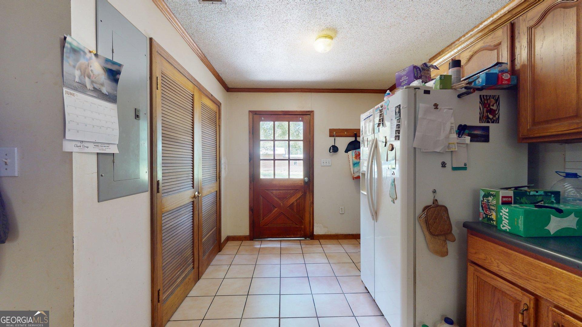 450 Bellevue Plantation Road Millen, GA 30442 - Photo 10 of 25 a view of hallway with washer and dryer