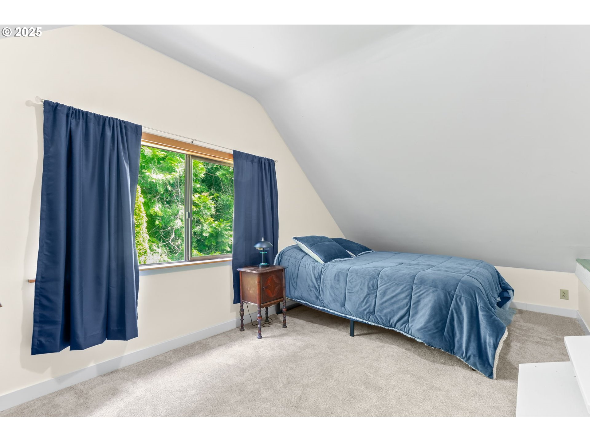 26011 South Morgan Road Estacada, OR 97023 - Photo 17 of 48 a bedroom with a bed and a window