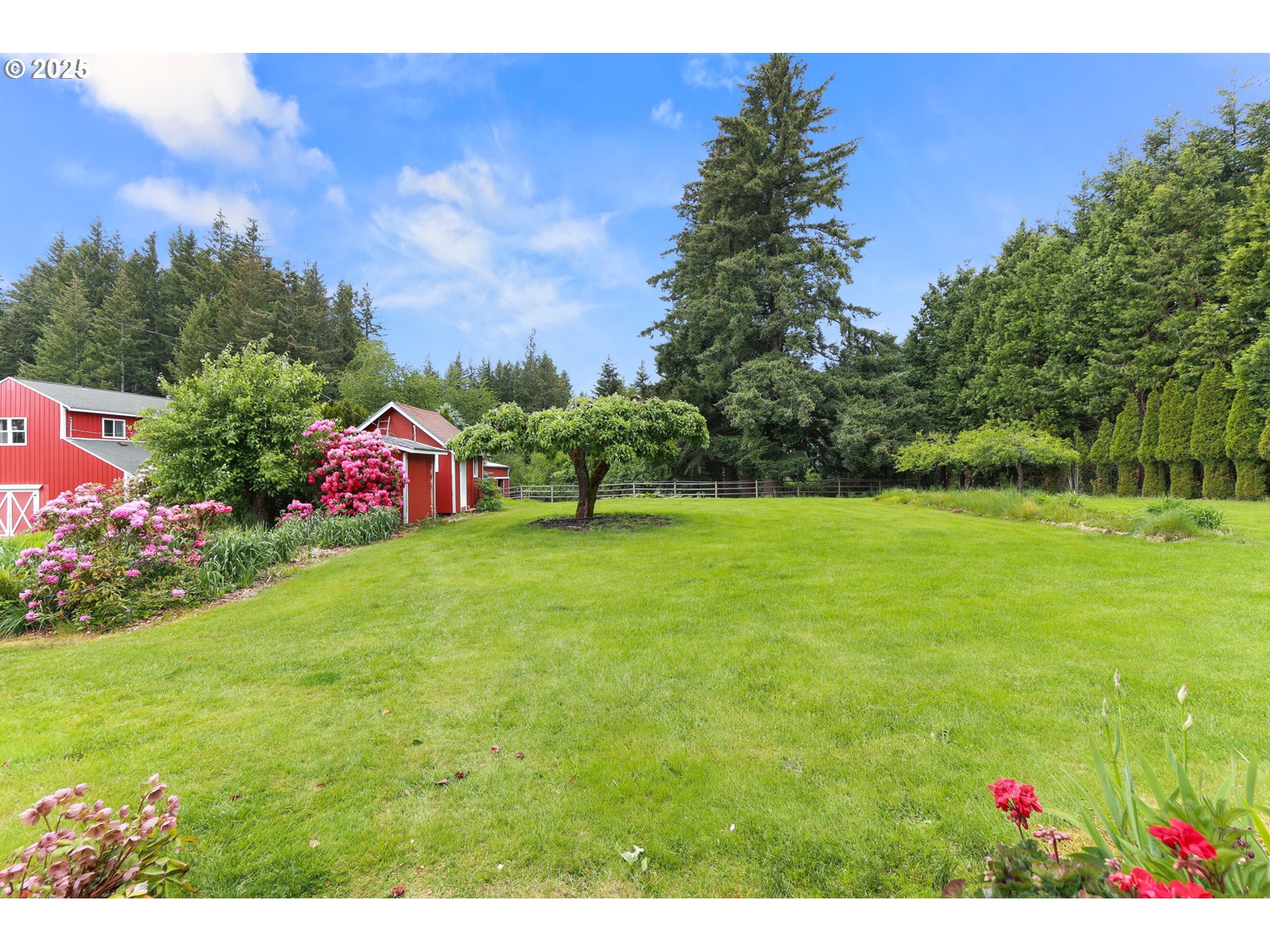 26011 South Morgan Road Estacada, OR 97023 - Photo 26 of 48 a view of a garden with a building in the background