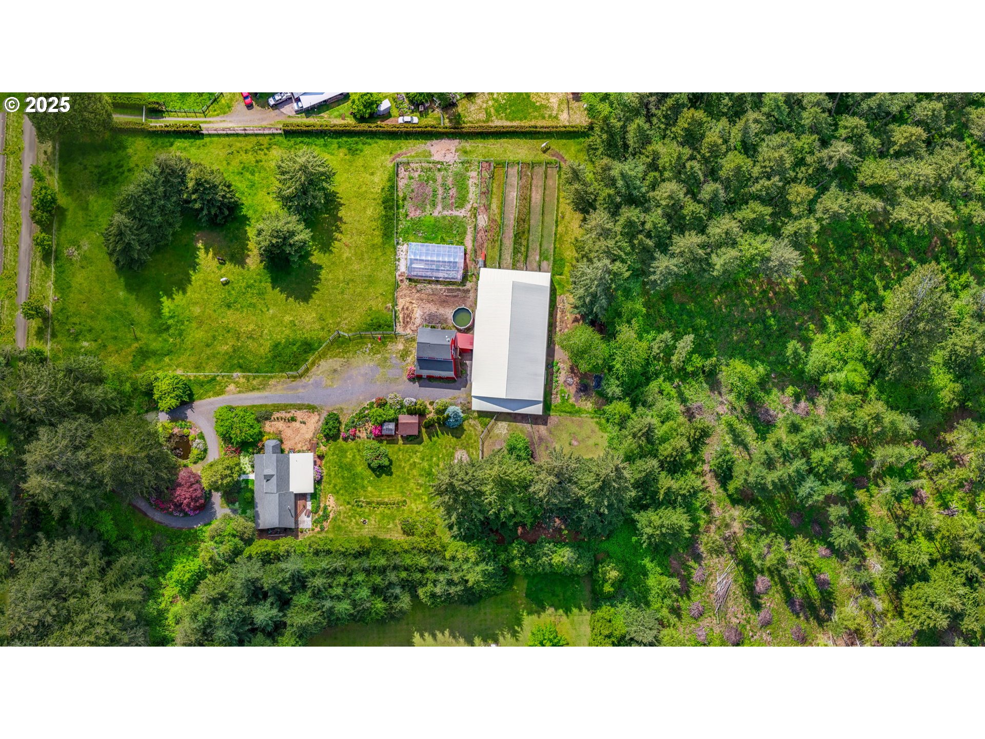 26011 South Morgan Road Estacada, OR 97023 - Photo 40 of 48 a upper view of a house with a garden