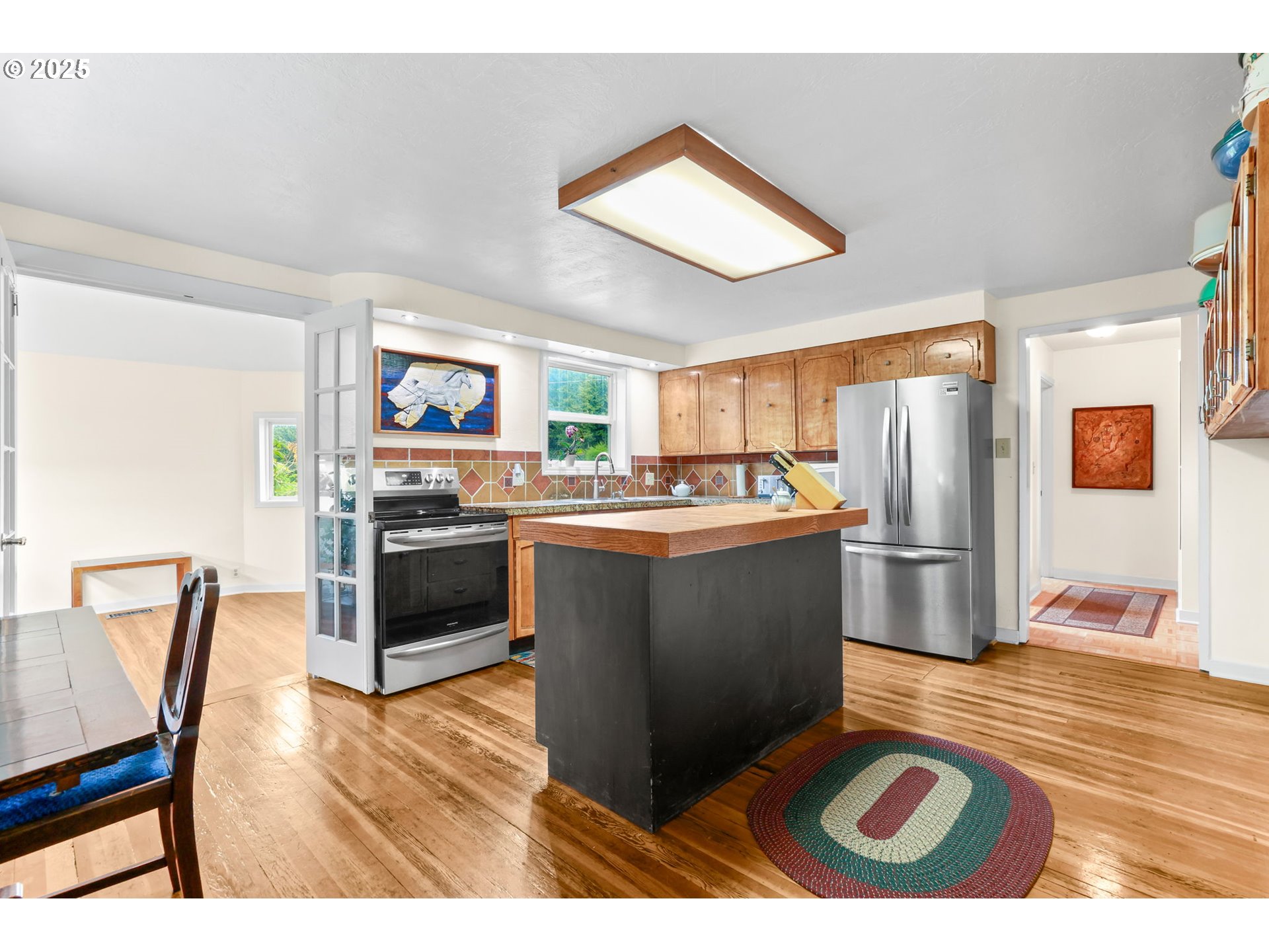 26011 South Morgan Road Estacada, OR 97023 - Photo 5 of 48 a kitchen with stainless steel appliances granite countertop a stove a sink dishwasher and a refrigerator