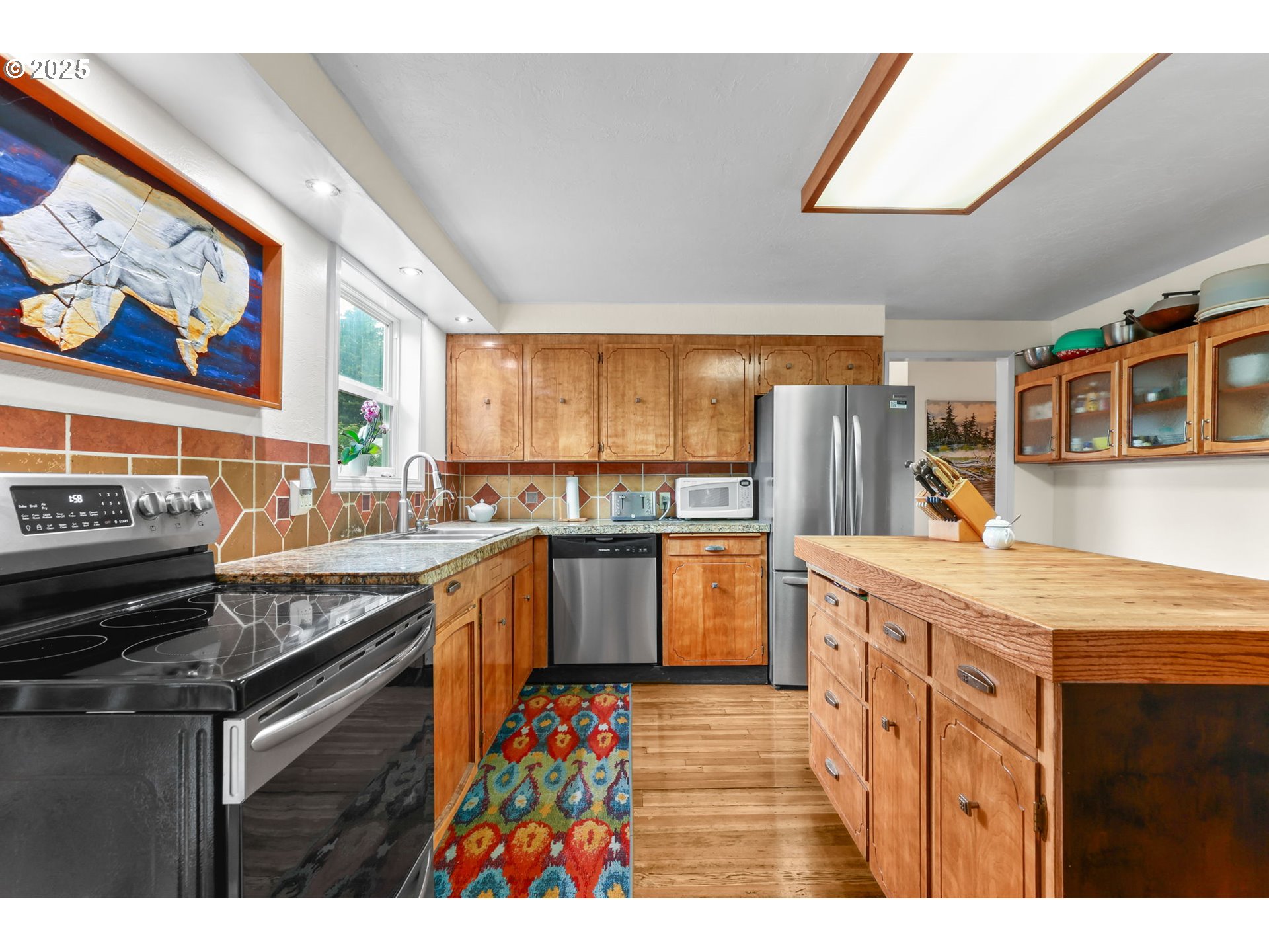 26011 South Morgan Road Estacada, OR 97023 - Photo 7 of 48 a kitchen with stainless steel appliances granite countertop a stove a sink and a refrigerator