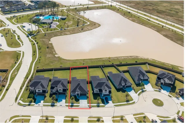 with view of swimming pool with seating area