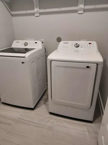 a utility room with dryer and washer