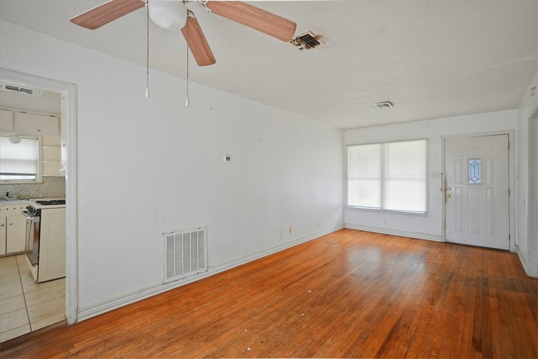 3633 Chestnut Street Corpus Christi, TX 78411 - Photo 19 of 22 a view of an empty room with wooden floor and a window