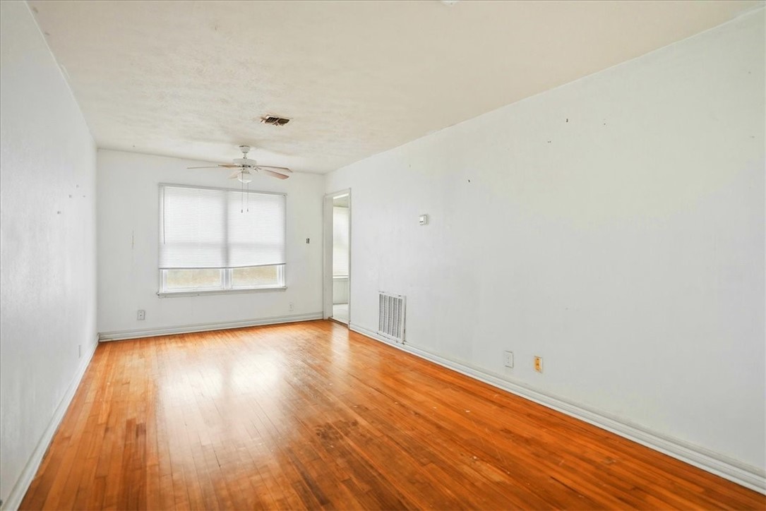 3633 Chestnut Street Corpus Christi, TX 78411 - Photo 8 of 22 wooden floor in an empty room