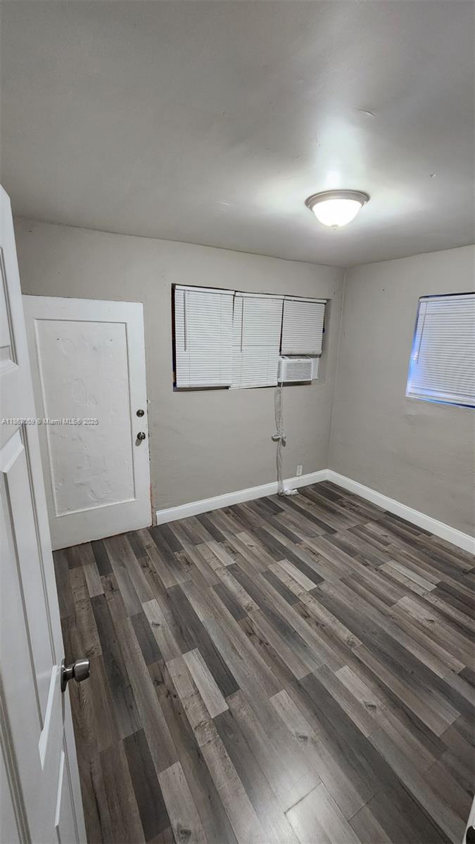 1761 Ali Baba Avenue, Unit 1 Opa-Locka, FL 33054 - Photo 2 of 10 a view of a room with wooden floor