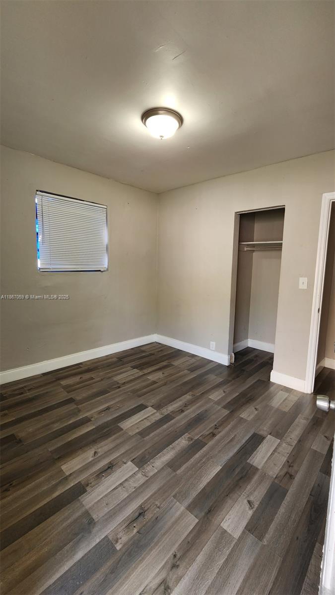 1761 Ali Baba Avenue, Unit 1 Opa-Locka, FL 33054 - Photo 7 of 10 a view of a room with wooden floor
