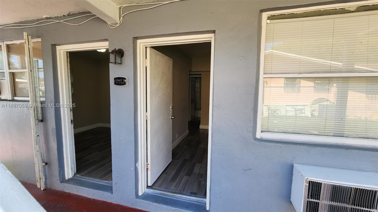 1761 Ali Baba Avenue, Unit 1 Opa-Locka, FL 33054 - Photo 8 of 10 a view of front door