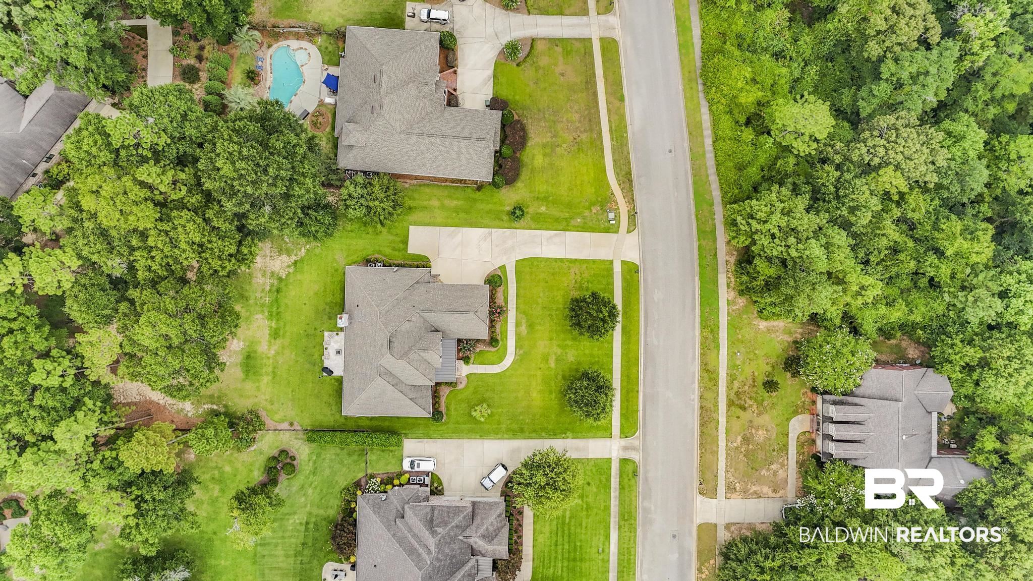 29949 Dolive Ridge Daphne, AL 36527 - Photo 50 of 55 Aerial perspective showcasing a residential street with manicured lawns and mature trees