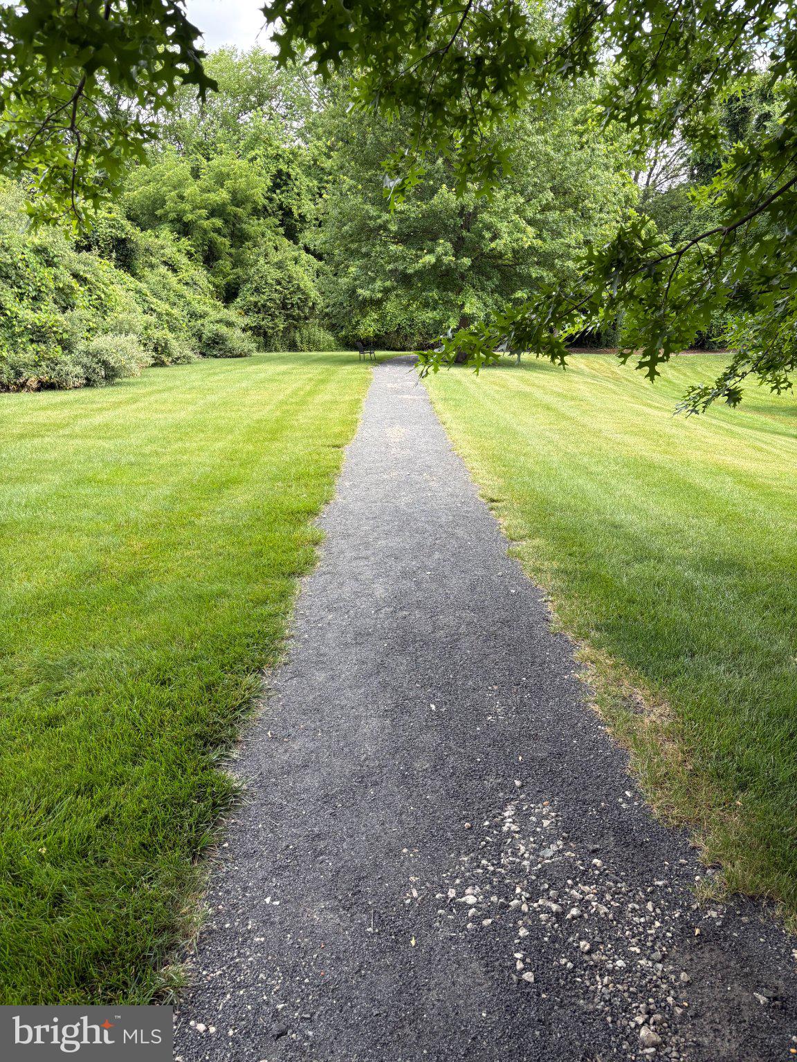 38 Kyle Way Ewing, NJ 08628 - Photo 30 of 38 Serene path through lush greenery.