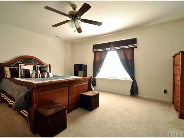 1421 Springshire Court Raleigh, NC 27610 - Photo 5 of 8 a bedroom with a bed and window