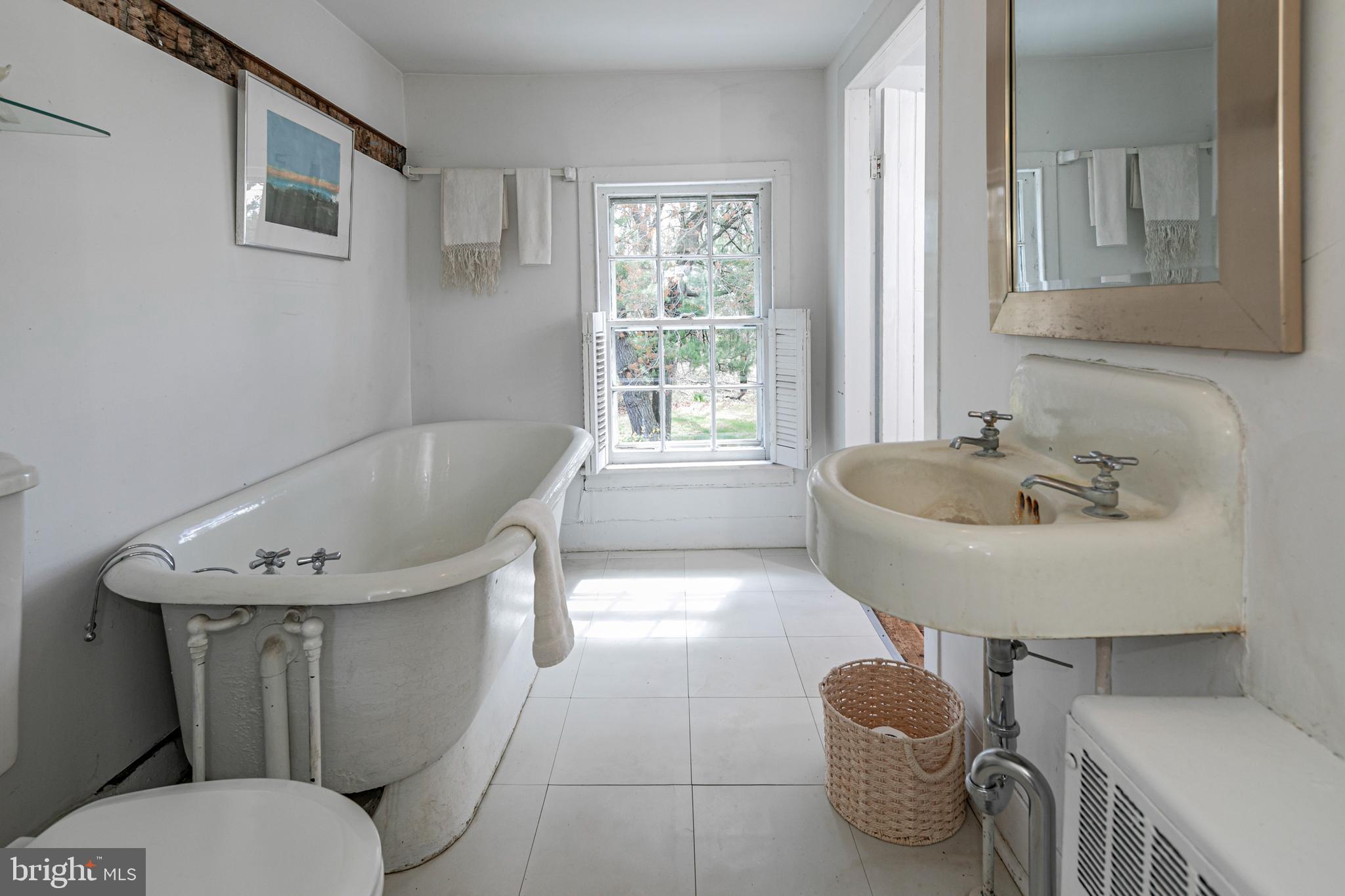 210 Cold Soil Road Princeton, NJ 08540 - Photo 25 of 37 a bathroom with a sink toilet and a bathtub
