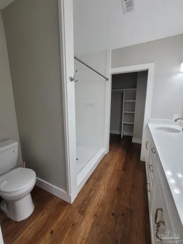 a bathroom with a sink and toilet