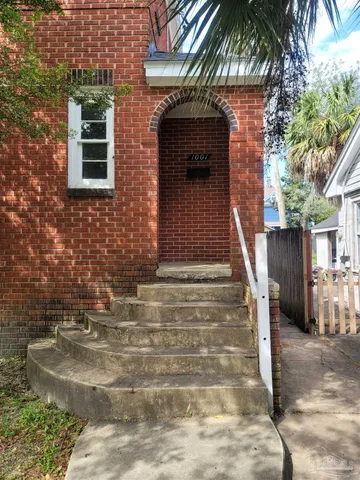 a view of house with outdoor space and stairs