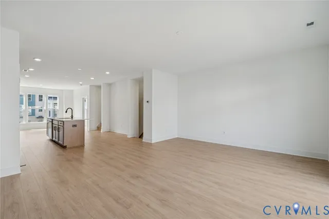 a view of kitchen with refrigerator and window