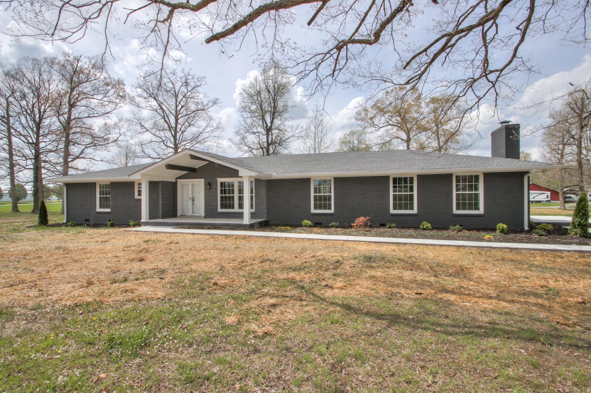 front view of a house with a yard