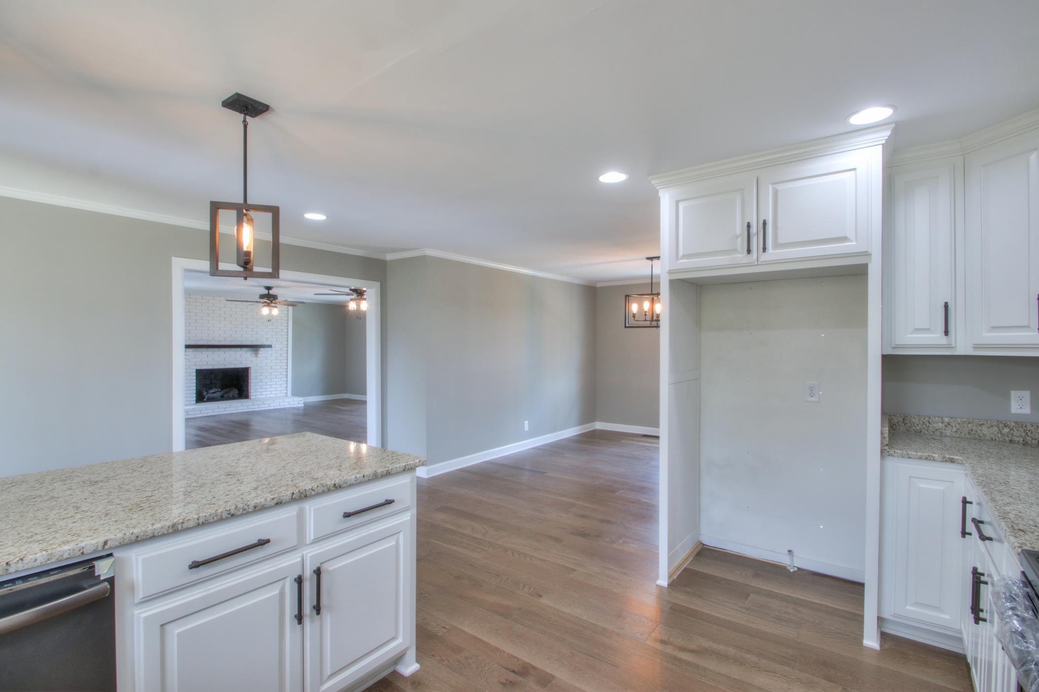 2964 Logan Road Greenbrier, TN 37073 - Photo 11 of 28 a kitchen with kitchen island a sink stainless steel appliances and cabinets