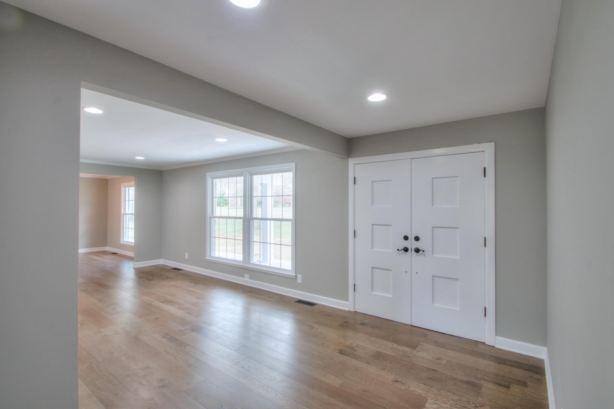 2964 Logan Road Greenbrier, TN 37073 - Photo 15 of 28 wooden floor in an empty room with a window
