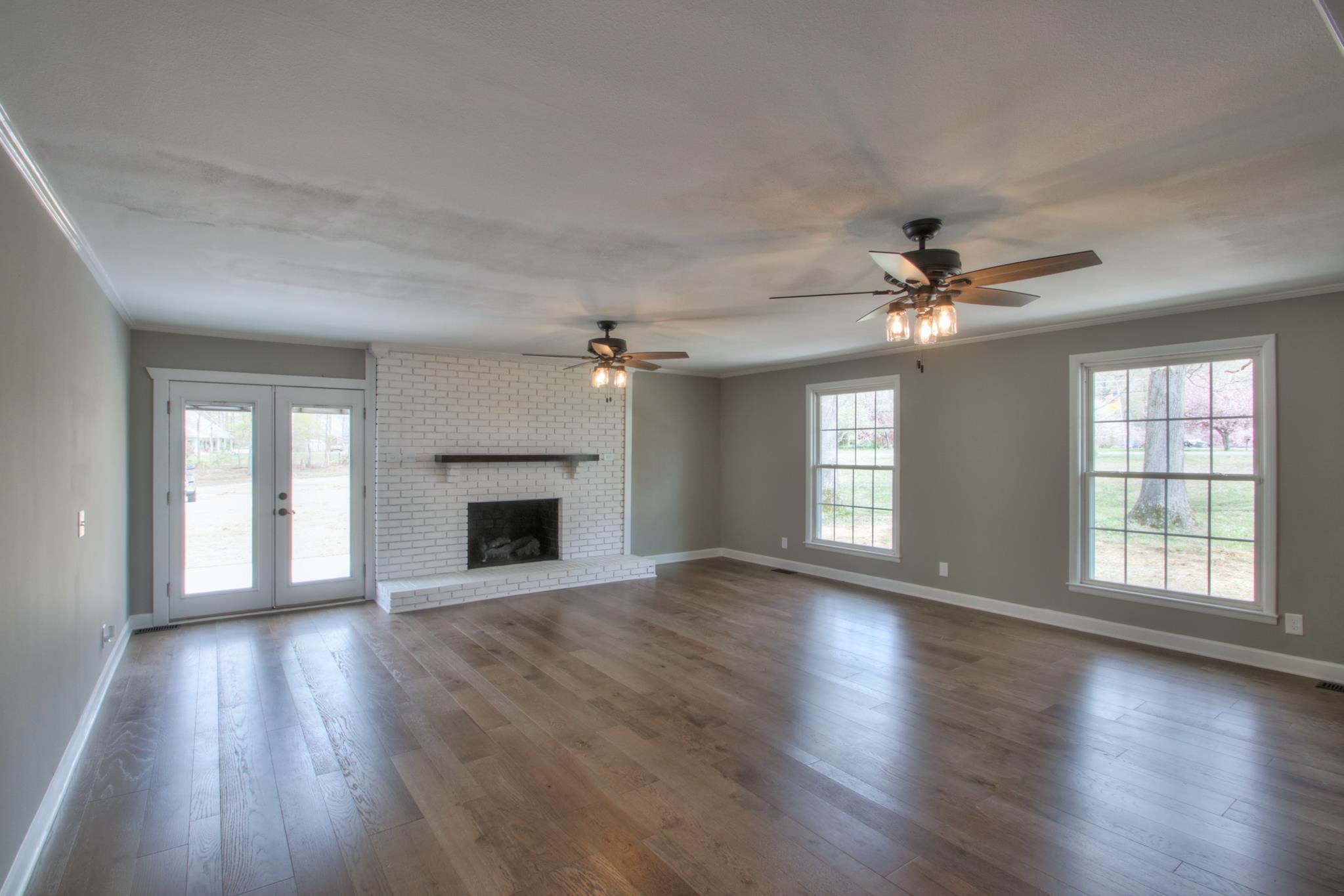 2964 Logan Road Greenbrier, TN 37073 - Photo 16 of 28 a view of an empty room with wooden floor and a window