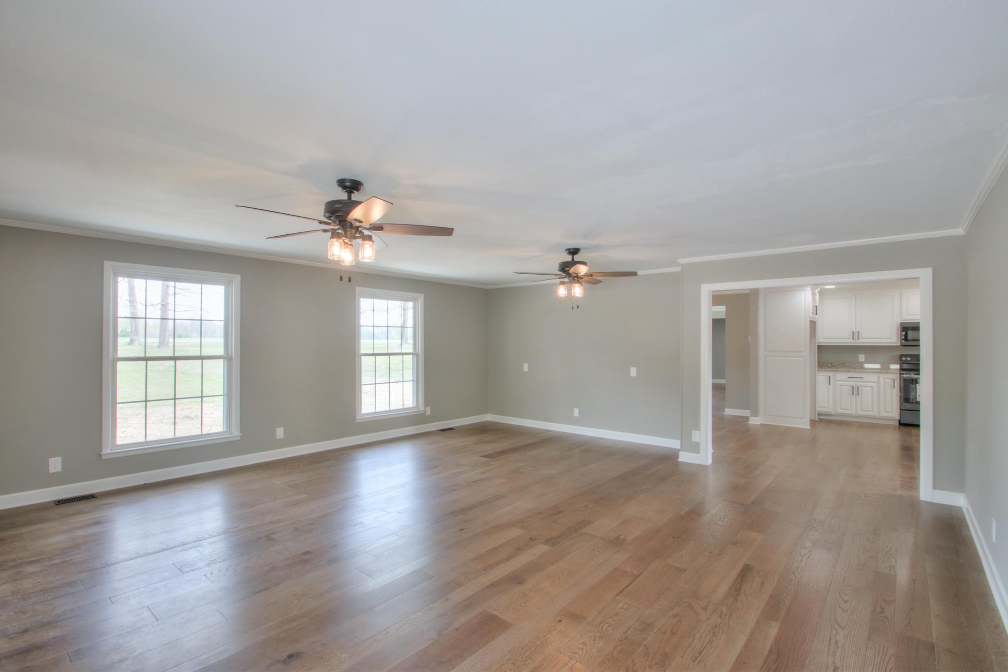 2964 Logan Road Greenbrier, TN 37073 - Photo 17 of 28 a view of an empty room with a window and wooden floor