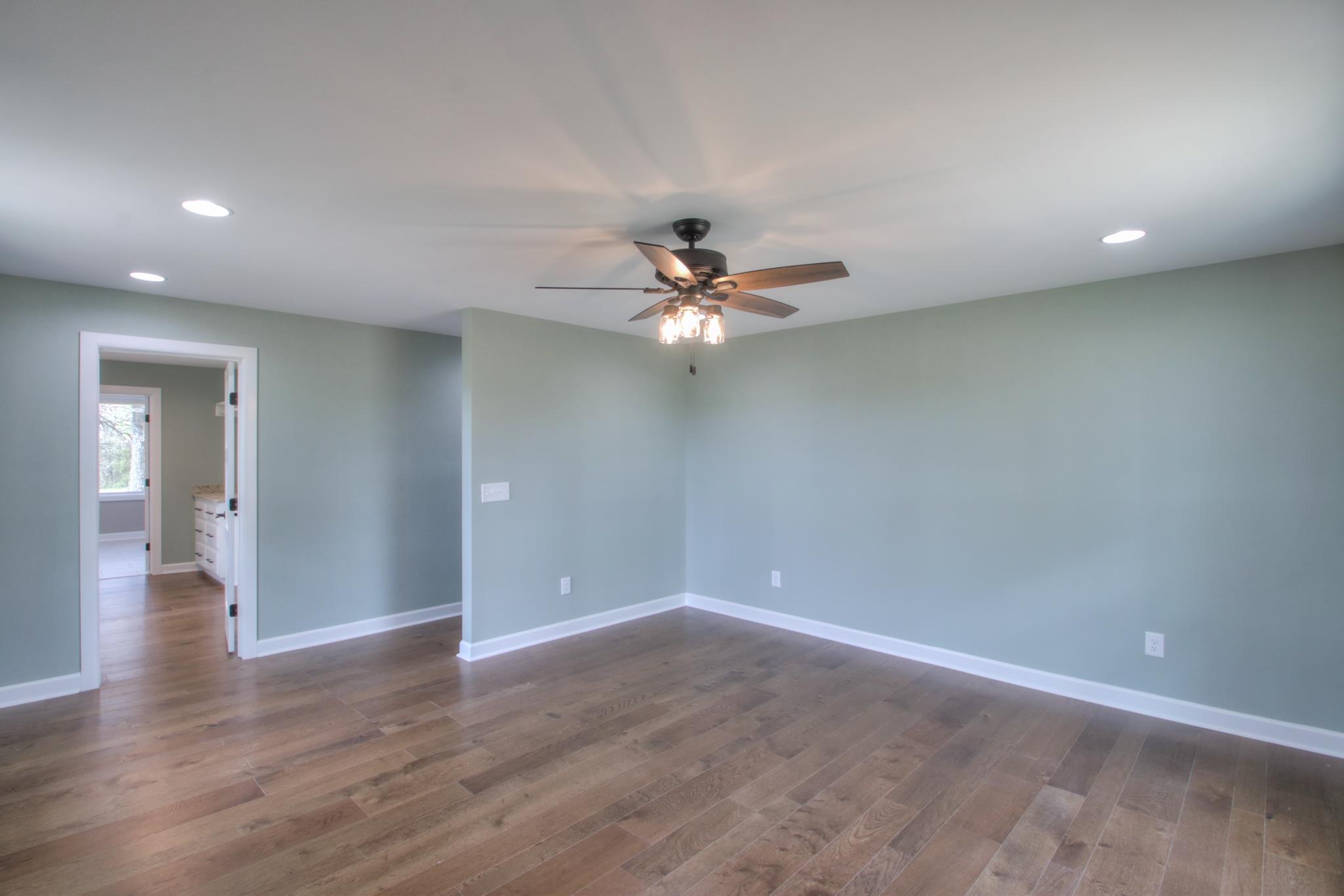 2964 Logan Road Greenbrier, TN 37073 - Photo 19 of 28 wooden floor in an empty room with a window