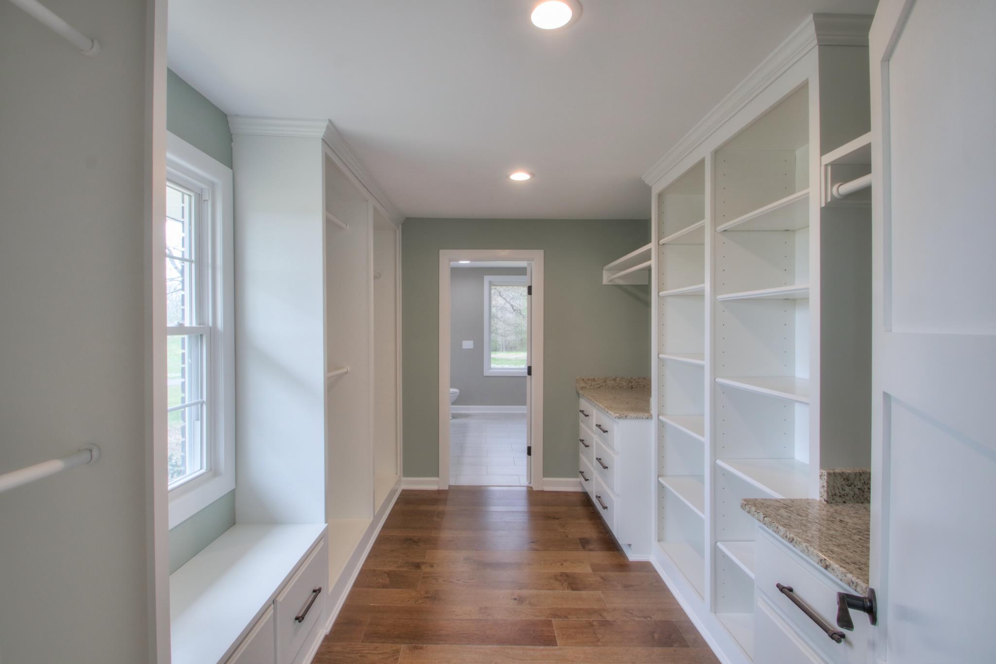 2964 Logan Road Greenbrier, TN 37073 - Photo 20 of 28 a view of a hallway with wooden floor and closet
