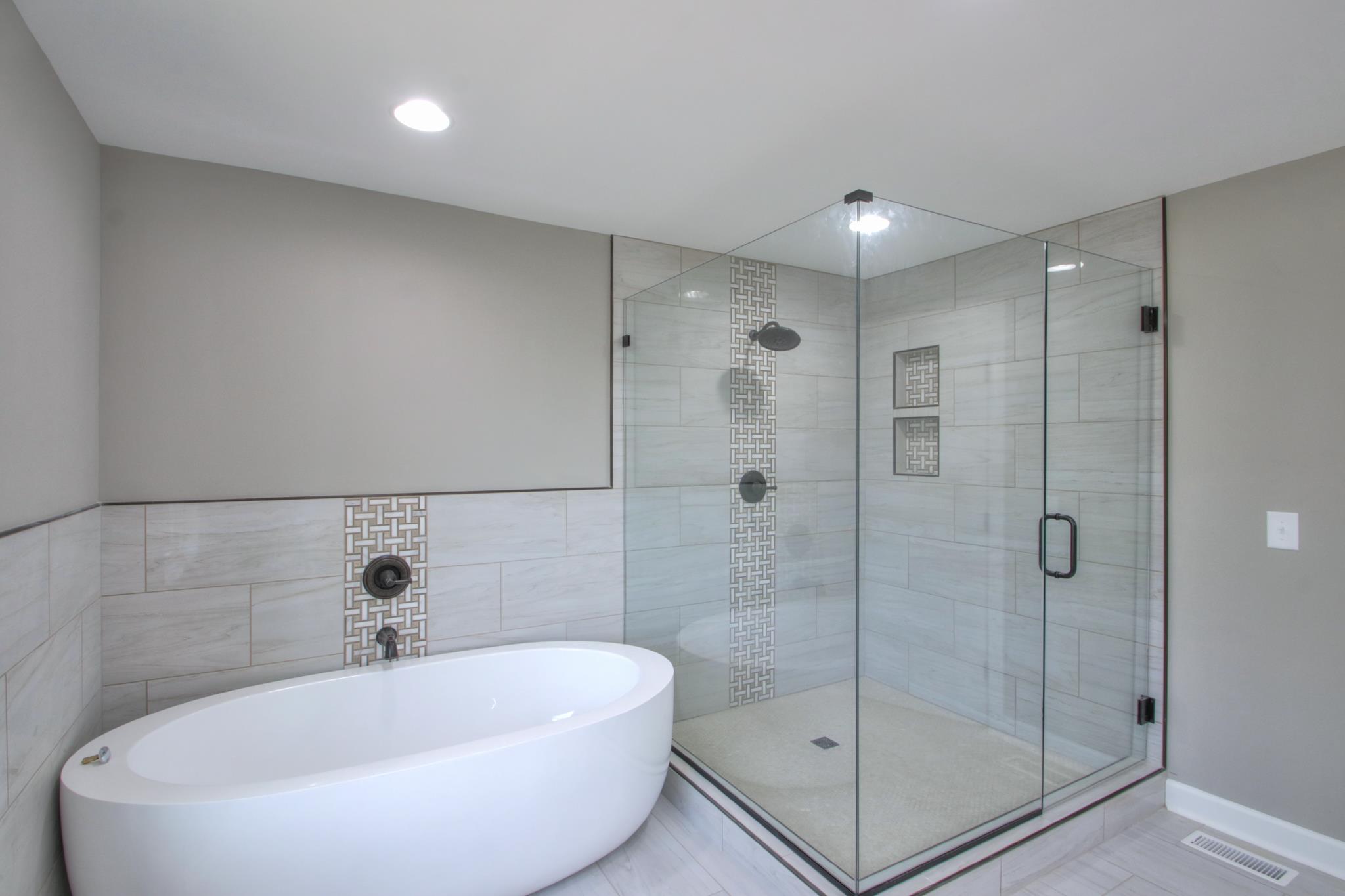 2964 Logan Road Greenbrier, TN 37073 - Photo 22 of 28 a bathroom with a bathtub and shower