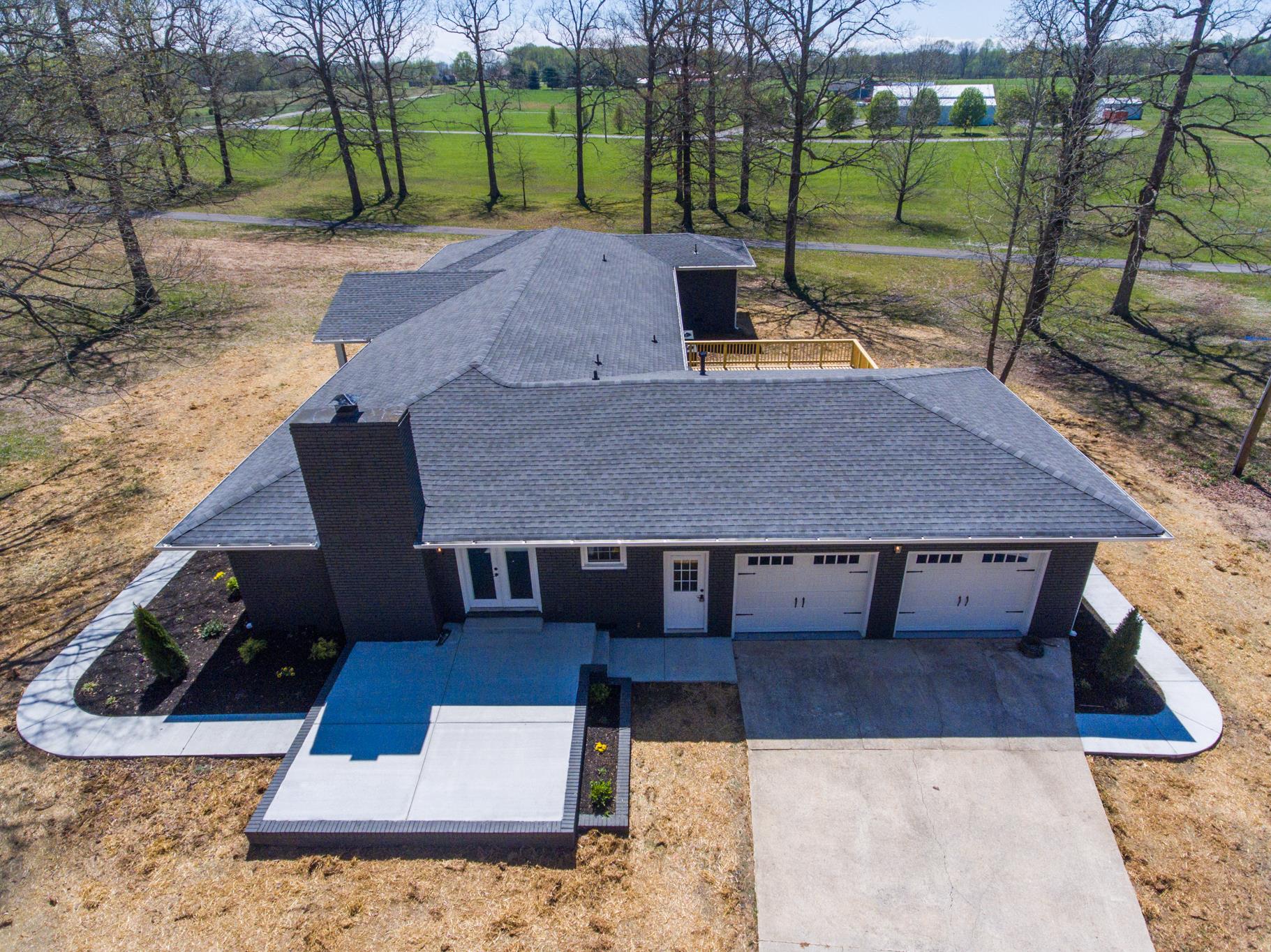 2964 Logan Road Greenbrier, TN 37073 - Photo 8 of 28 a view of a patio with table and chairs with wooden floor and fence