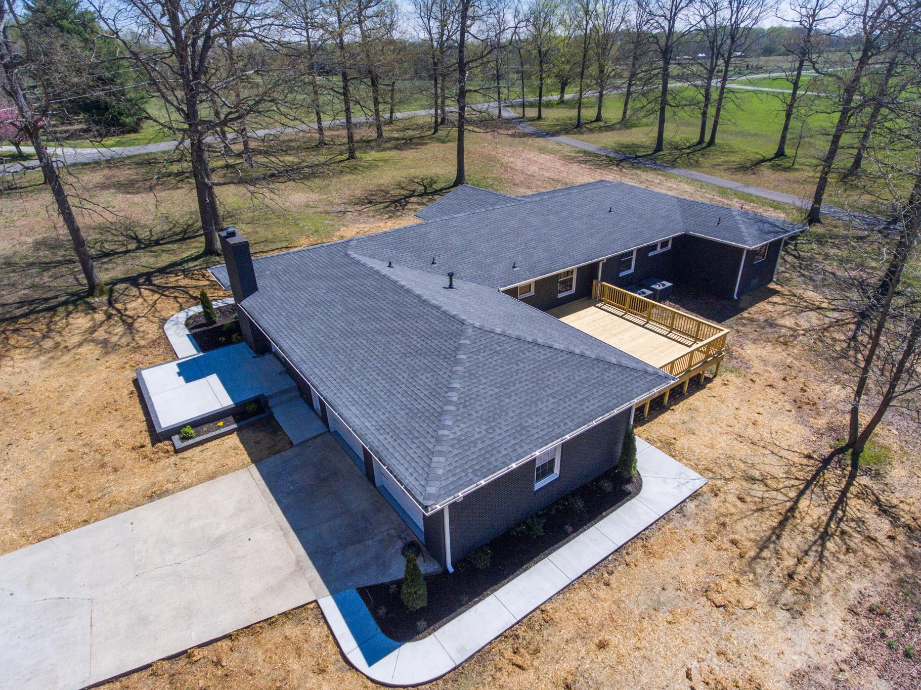 2964 Logan Road Greenbrier, TN 37073 - Photo 9 of 28 a view of backyard with deck and a garden