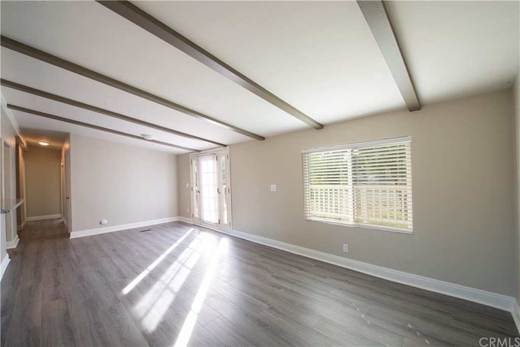 32785 Batson Lane Wildomar, CA 92595 - Photo 12 of 21 Front living room. Hallway leads to 2 bedrooms, a hallway bathroom with built in shelving, an indoor laundry room with built in cabinets and a coat closet.