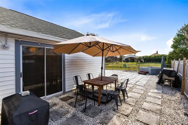 a view of an outdoor sitting area with furniture