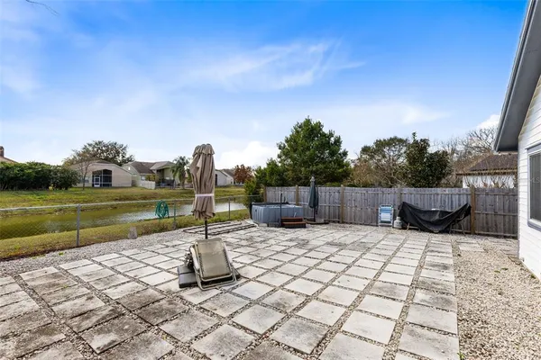 a view of a backyard with a sitting area