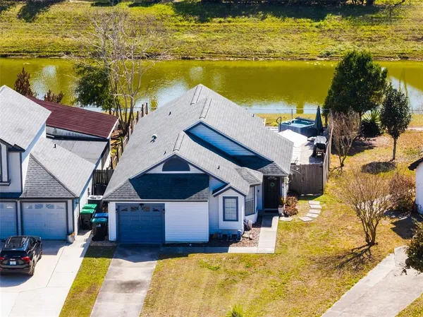 a swimming pool with some potted plants by side of it
