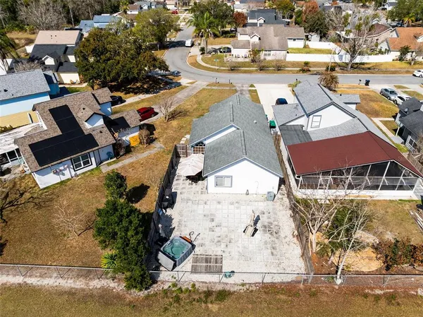 an aerial view of a house with outdoor space