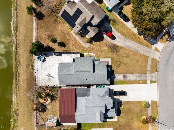 an aerial view of residential houses with outdoor space