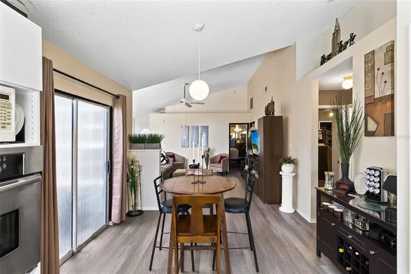 a view of a dining room with furniture window and wooden floor