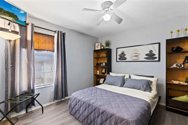 a bedroom with a bed and a window