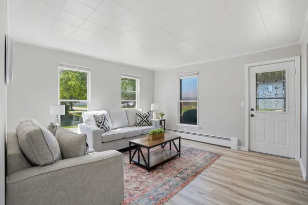 a living room with furniture and a window